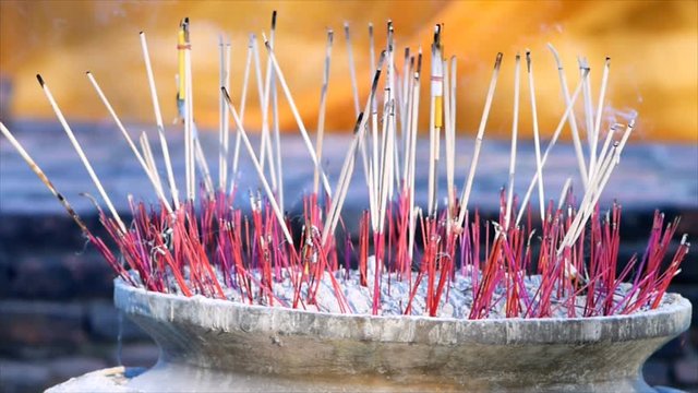 Close up burning joss stick in pot in temple, Thailand