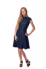 Young pretty long haired blonde woman posing in fashion dress on white background in a studio. Spring summer photo, catalog collection.