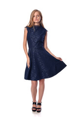 Young pretty long haired blonde woman posing in fashion dress on white background in a studio. Spring summer photo, catalog collection.