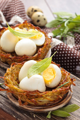 Boiled eggs in nests.