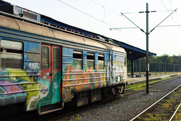Fototapeta na wymiar Train With Graffiti Waiting at the Station