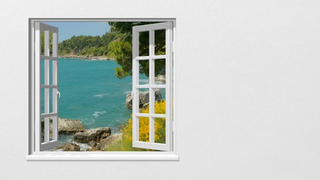 Looking out through the window at the sea in summer

