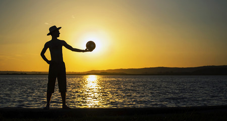 Website banner of a young man silhouette at sunset