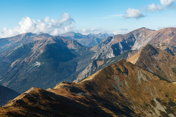 Blue cloudy sky over mountain path