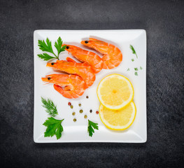 Red Shrimps on White Plate and with Cooking Herbs