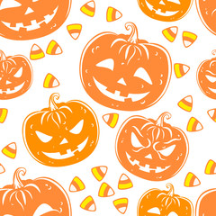 Seamless pattern with a pumpkins and candies.
