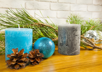 New Year and Christmas composition with fir cones and two candle