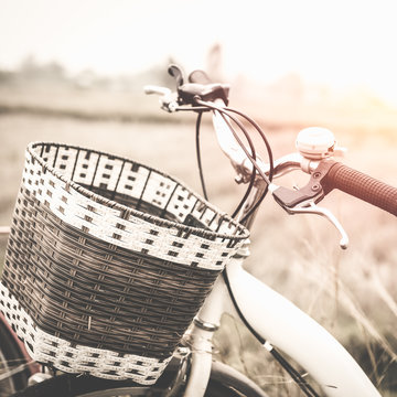 beautiful landscape image with Bicycle at sunset ; vintage filte