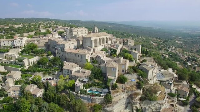 Aerial view of Gordes, labelled Most Beautiful Villages of France, perched on a rocky outcrop at the end of the Vaucluse plateau, 4K, UHD (3840X2160)