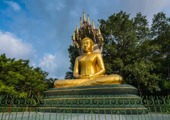 Golden  Buddha  with a naga  in  Wat Chak Yai  Chanthaburi, Thailand.