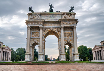 Fototapeta na wymiar Milan, Italy: Arch of Peace (Arco della Pace) and the Sforza Castle (Castello Sforzesco) in the background