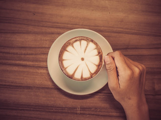 cup of coffee in coffee shop made with vintage filter