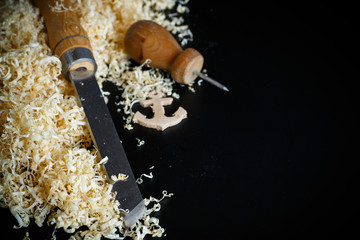 Woodworking tools. Chisel with sawdust .