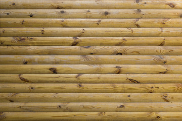 New log wall background. Wooden wall made of logs