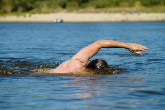 close-up of a man floating in the water