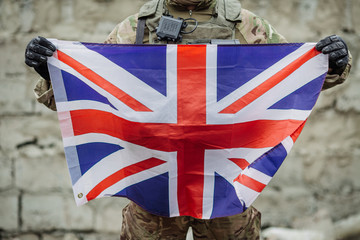 Soldier holding British flag