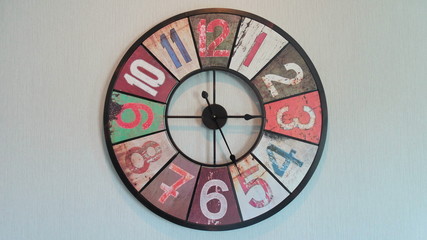 Modern art style of clock hanging on wall