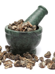 Organic Indian Gooseberry or Amla  (Ribes uva-crispa) on marble pestle and over white background