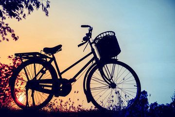 Fototapeta na wymiar beautiful landscape image with Bicycle silhouette at sunset