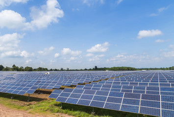 solar panels in solar power station on blue sky background