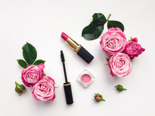 Decorative flat lay composition with cosmetics and flowers