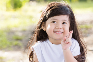 Cute Asian baby Smiling in garden.