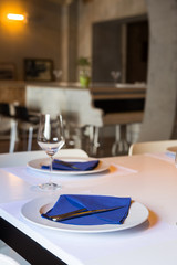 table set up in elegant restaurant interior,selective focus