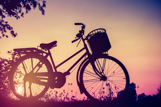 Landscape picture Vintage Bicycle with Summer grass field at sun