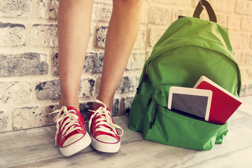 Student girl legs with backpack