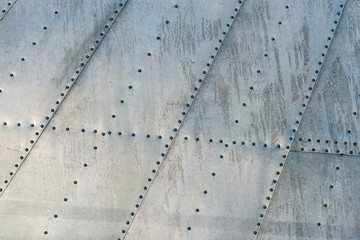 Fuselage area and rivets of a vintage aircraft