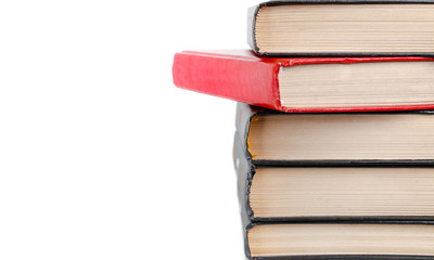 closeup stack of old books isolated on white background