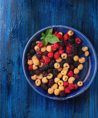 Heap of colorful raspberries 