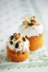 Easter lholiday cake with nuts dried fruits on white tablecloth