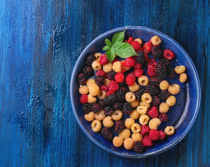 Heap of colorful raspberries 