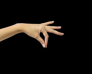 Closeup action of woman hand catching and hold something in hand isolated on black background with clipping path