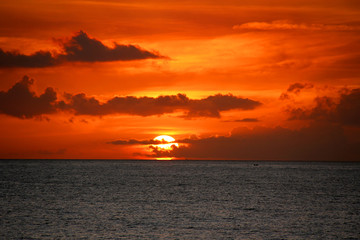 Naklejka na ściany i meble sunset at atlantic ocean in curacao