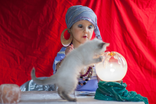 child fortune teller with her cat
