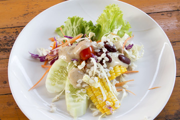 fruit and vegetable salad on wood table