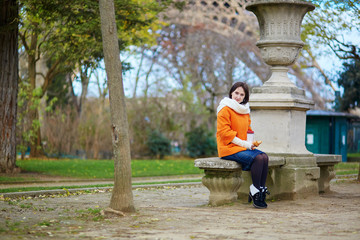 Cheerful young woman in Paris