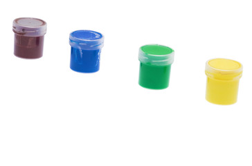 Group of plastic jars with paint isolated on white