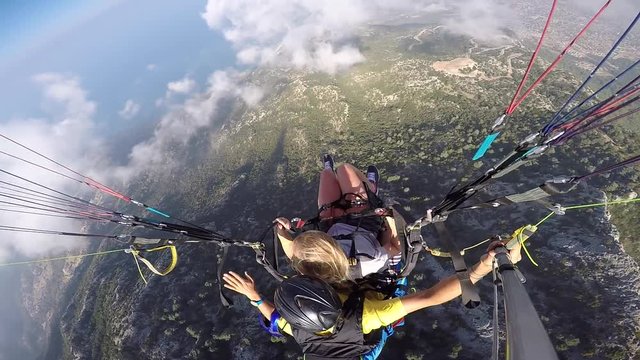 Tandem paragliding. Fear and joy. Extreme touristic Attraction.