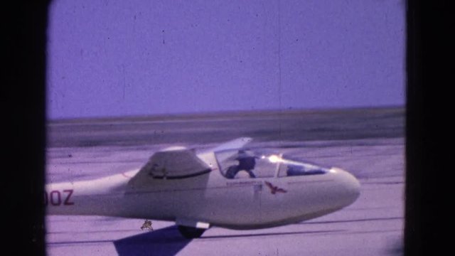 1964: white aircraft safely landing on runway in the desert COTTONWOOD, ARIZONA