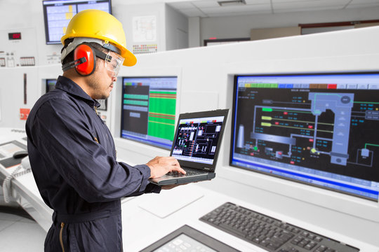 Electrical Engineer Working At Control Room Of A Modern Thermal