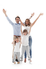 Happy family with raised hands