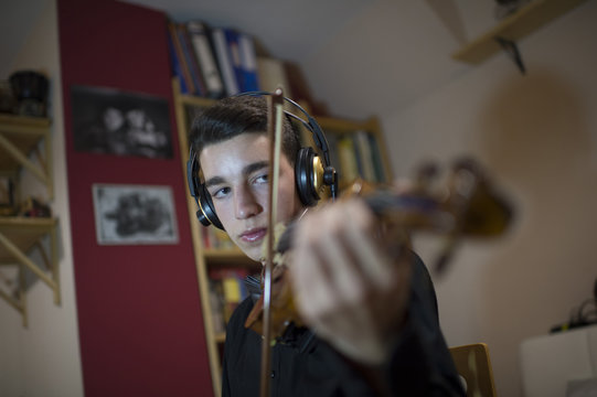 Teen playing a violin