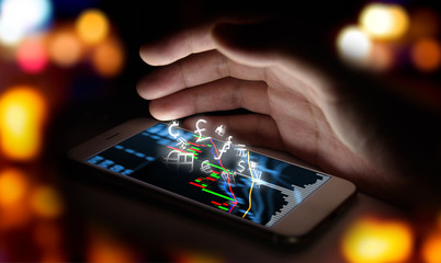 Currencies sign icon and smartphone with stock market graph screen and hand with bokeh blur background , Stock market trading concept , Fintech Investment Financial Internet Technology Concept.