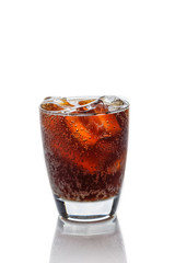 Cola in glass with ice cubes on a white background