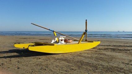 Obraz premium Yellow rescue boat on Italian beach. Adriatic sea.