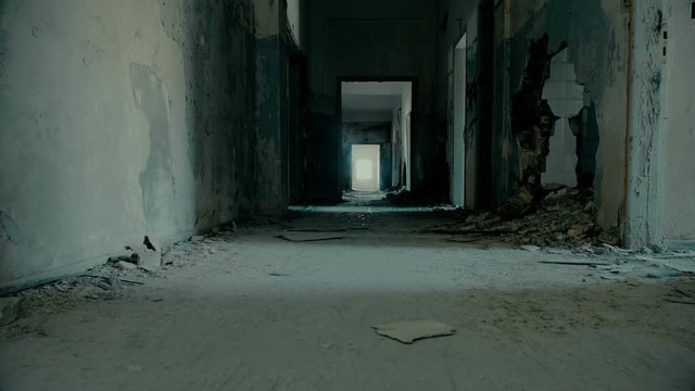 Tracking a long corridor/hallway of a big building destroyed by an earthquake and evacuated.Full motion control,tracking, pan, and tilt.