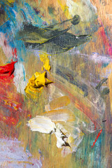 Colored palette of oil paints. Creative wood background